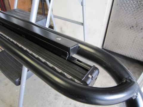 2008 Jeep Wrangler - A close-up view shows a black light bar attached to a curved metal bar, possibly a vehicle accessory.