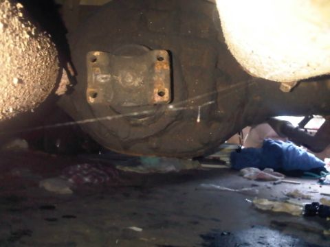 1973 Ford Ranchero - Underside view of a vehicle's differential and axle assembly, showing mechanical parts.