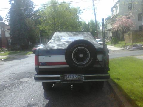 1988 Ford Bronco - This Ford Bronco appears to be from the late 1980s, with a soft top and external spare tire.