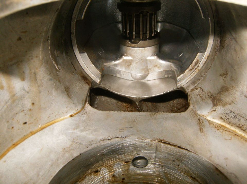 Close-up of a metal engine component with a splined shaft