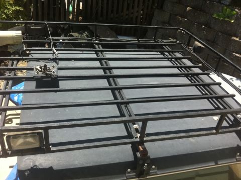 1990 Ford Bronco - Custom roof rack installed on a vehicle, showing its construction and mounting points.