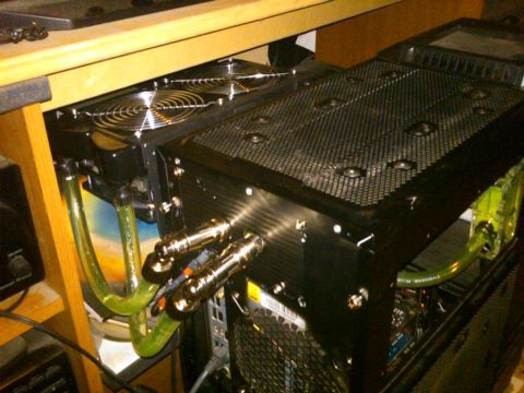 1997 Ford Crown Victoria - A computer case with visible liquid cooling tubes and fans is shown from the side.