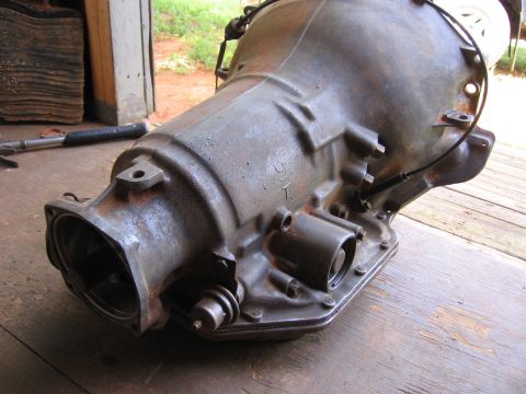 1980 Jeep CJ7 - This automatic transmission, possibly from a 1991 vehicle, is shown resting on a wooden deck.