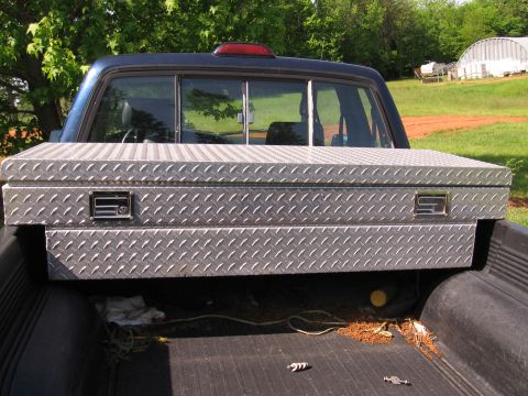 1980 Jeep CJ7 - Diamond plate toolbox installed in the bed of a pickup truck.