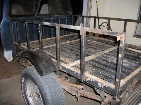 1994 Ford Explorer - Rear view of a pickup truck bed modified with a custom metal rack structure.