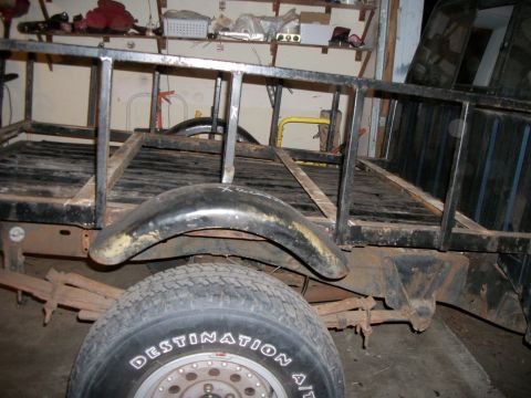 1994 Ford Explorer - A custom truck bed with a metal frame is shown, a rear fender and a tire with 'Destination A/T' visible.