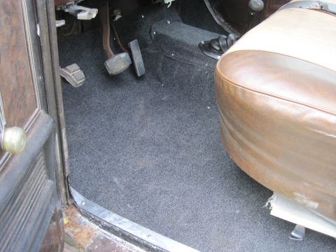 1979 Ford Bronco - Close-up view of the interior floor and a portion of the passenger seat.