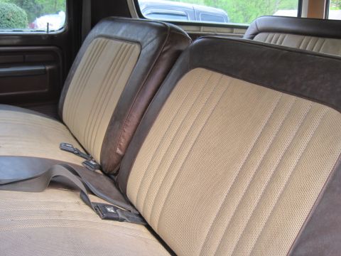 1979 Ford Bronco - Interior view of a 1979 Ford Bronco showing the front seats and seatbelts.