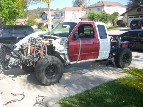 1992 Ford Ranger - This 1992 Ford Ranger is being modified, with its front end disassembled and engine exposed.