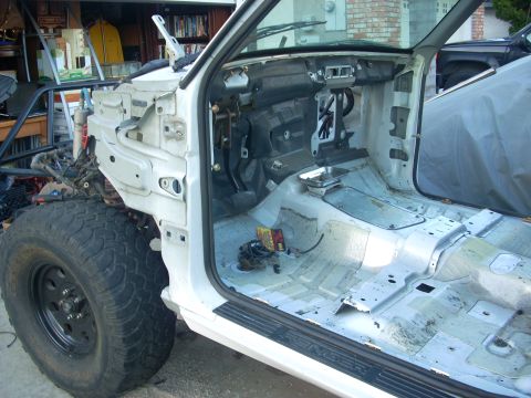 1992 Ford Ranger - The interior of a 1992 Ford Ranger is shown with all components removed, revealing the bare metal chassis and dashboard.