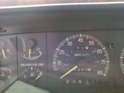 1989 Ford Bronco - A close-up view of a vehicle's dashboard, showing various gauges including the speedometer, fuel level, oil pressure, and engine temperatur…