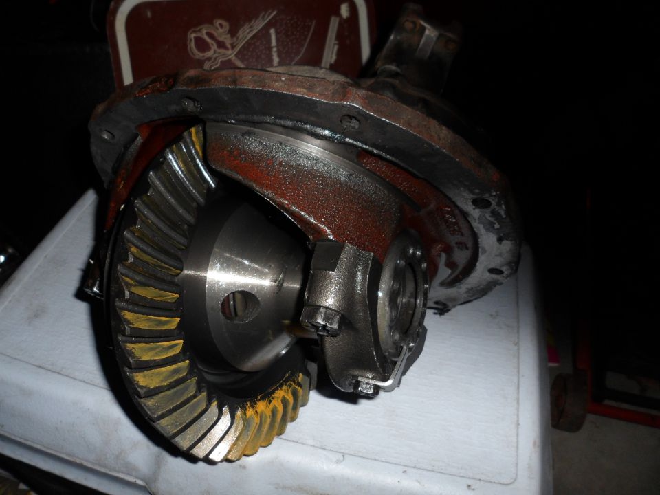 Differential housing with ring and pinion gears visible. Some yellowing on gear teeth