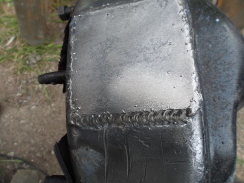 1991 Ford Bronco - This photo shows a close-up of a metal component that has been welded, with a Supermotors.net watermark visible.