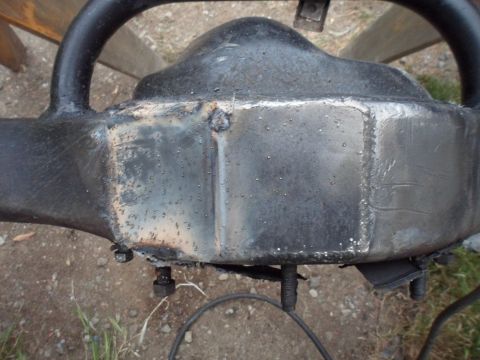 1991 Ford Bronco - Close-up view of a rear axle differential, showing welds and mounting hardware.