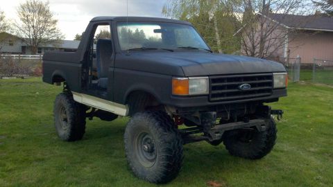 1988 Ford Bronco - This lifted 1987 Ford Bronco features a matte black finish and has had its doors removed.