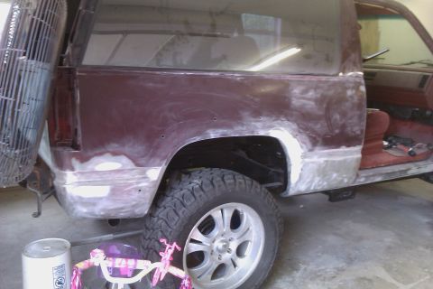 1994 Chevrolet Blazer - This 1994 Chevrolet Blazer is undergoing bodywork, with primer visible on the rear quarter panel and lower body.
