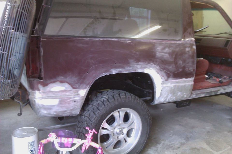 Maroon 1994 Chevrolet Blazer side view, showing bodywork and primer