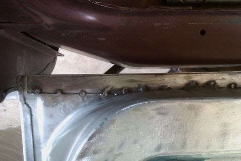 1994 Chevrolet Blazer - Metal panel repair showing numerous welds, likely part of a vehicle bodywork.