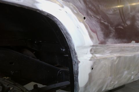 1994 Chevrolet Blazer - Bodywork is underway on the fender and wheel well of a vehicle, obscuring its year and model.