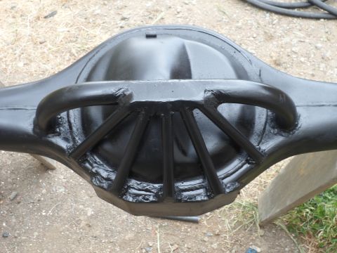 1991 Ford Bronco - A black differential housing with visible welds and support structures is shown from a rear angle.