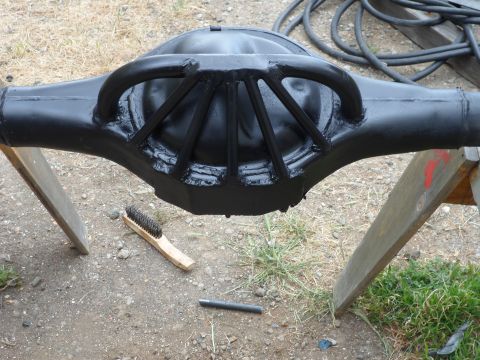 1991 Ford Bronco - A Ford rear axle differential housing, painted black, is shown resting on sawhorses.