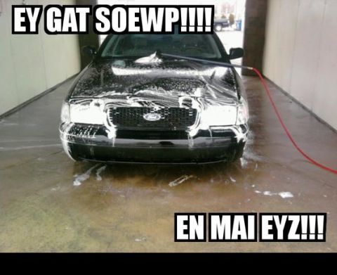 2000 Mercury Grand Marquis - Black sedan being washed at a car wash.