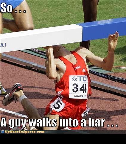2000 Mercury Grand Marquis - A runner is shown in a humorous pose after falling under a hurdle during a track event.