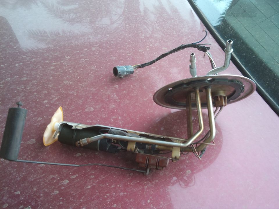 Fuel pump assembly with sender unit and electrical connector