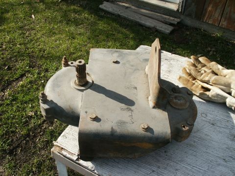 1966 Ford Bronco - This is a metal gearbox assembly with a splined shaft and mounting bracket.
