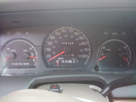 2001 Ford Crown Victoria - Interior view of a car's dashboard gauges, including the speedometer and fuel level indicator.
