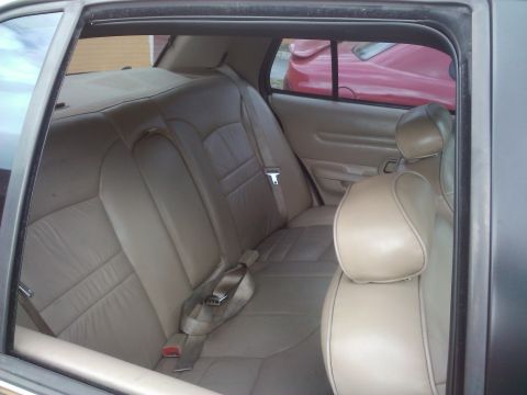 2001 Ford Crown Victoria - The interior of a car is shown, with a glimpse of another vehicle outside.
