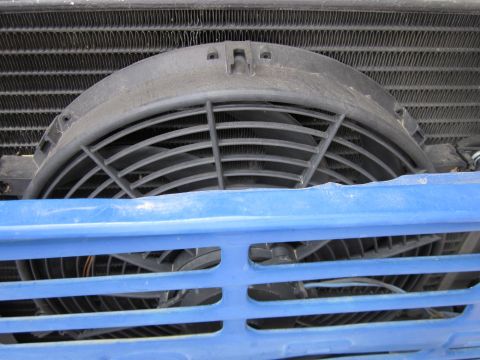 1971 Ford Bronco - Close-up view of a vehicle's radiator fan and grille section.