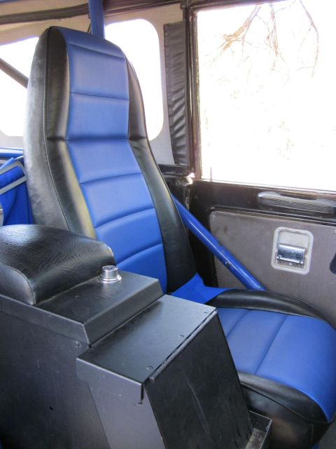 1971 Ford Bronco - Custom blue and black seats and center console visible inside a vehicle's interior.