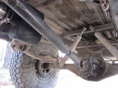 1971 Ford Bronco - Close-up of the rear suspension and axle components of an off-road vehicle.