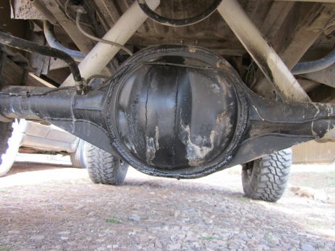 1971 Ford Bronco - Underside view of a vehicle's rear axle and suspension system.