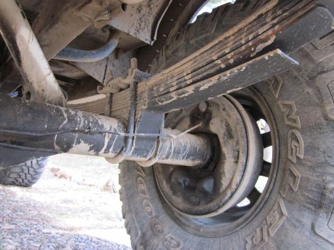 1971 Ford Bronco - Close-up view of the rear leaf spring suspension and tire on a 1971 Ford Bronco.