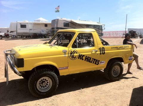 1986 Ford Bronco - This modified truck features off-road tires, a custom bumper, and racing decals.