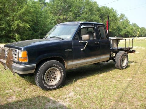 1994 Ford Explorer - This modified Ford Ranger pickup truck features a custom flatbed and a heavy-duty front bumper.