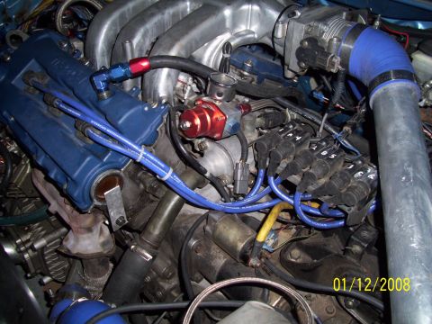 1995 Ford Probe - Close-up view of an engine bay, showing various components and modifications.