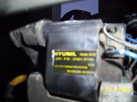 1995 Ford Probe - Ignition coil with a HYUNIL label, part number HSA 610, made in Korea.