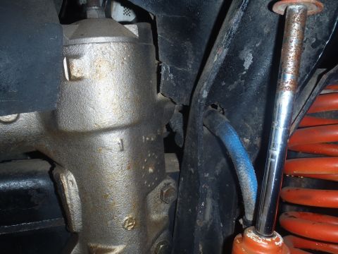 1979 Ford Bronco - Underside view of steering gear and suspension parts, likely from an older vehicle.