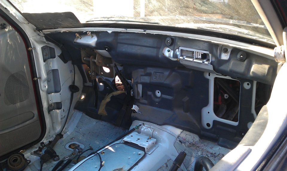 1992 Ford Ranger interior, dashboard removed, showing exposed wiring and metal frame