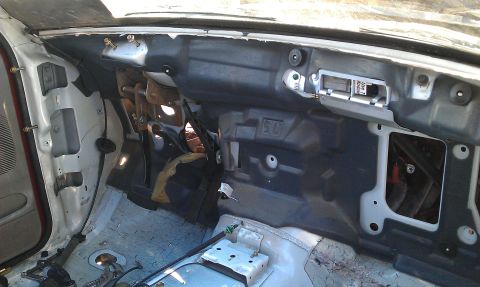 1992 Ford Ranger - The interior of a vehicle is shown with the dashboard removed, revealing the underlying structure and wiring.