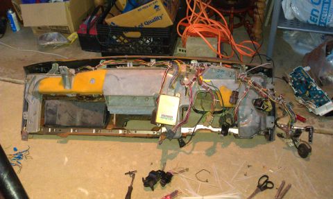 1992 Ford Ranger - Dashboard assembly removed from a vehicle, showing complex wiring and internal components.