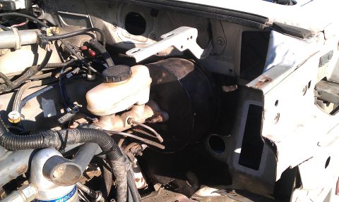 1992 Ford Ranger - Close-up of the brake booster and master cylinder assembly.