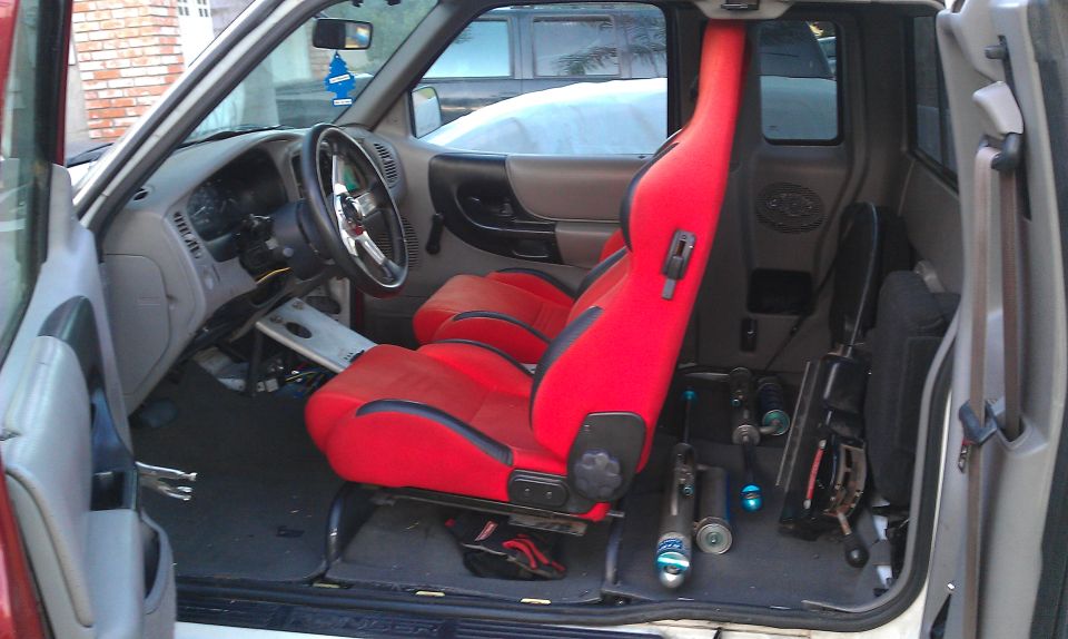 1992 Ford Ranger interior with red racing seats and aftermarket steering wheel