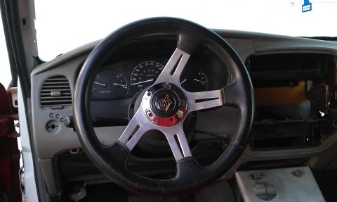 1992 Ford Ranger - Interior view of a 1992 Ford Ranger, showing the dashboard and an aftermarket steering wheel.