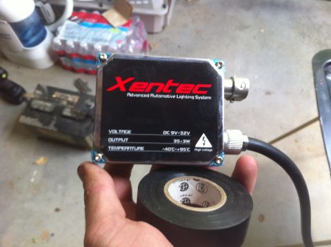 1990 Ford Bronco - A Xentec Advanced Automotive Lighting System ballast is held in hand, showing its specifications.