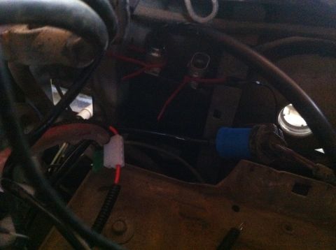 1990 Ford Bronco - Close-up view of wiring and components within a vehicle's engine bay.