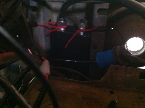 1990 Ford Bronco - Close-up of battery terminals and wiring, with some blue insulation visible.